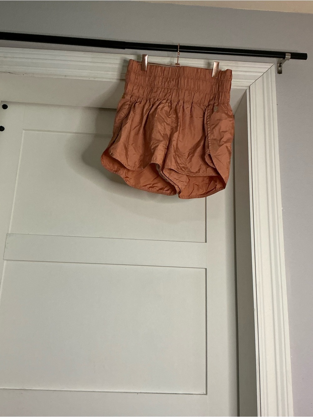 FP Movement by Free People High-Rise Smocked Athletic Shorts in Rusty Orange